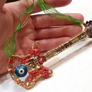 Amethyst eye bass hand wrapped pendant